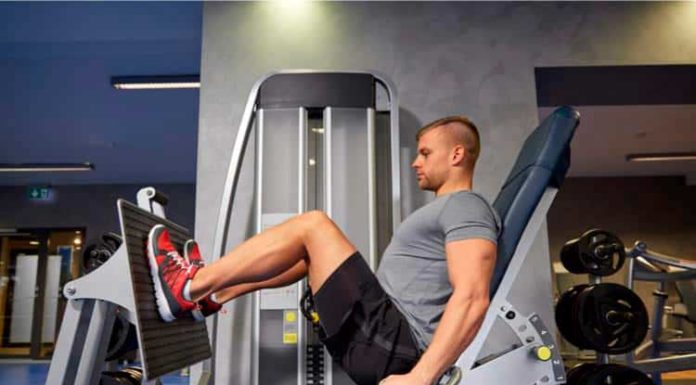 Rest Pause – Poupe Tempo na Academia e Tenha Mais Resultados! Homem performando leg press horizontal